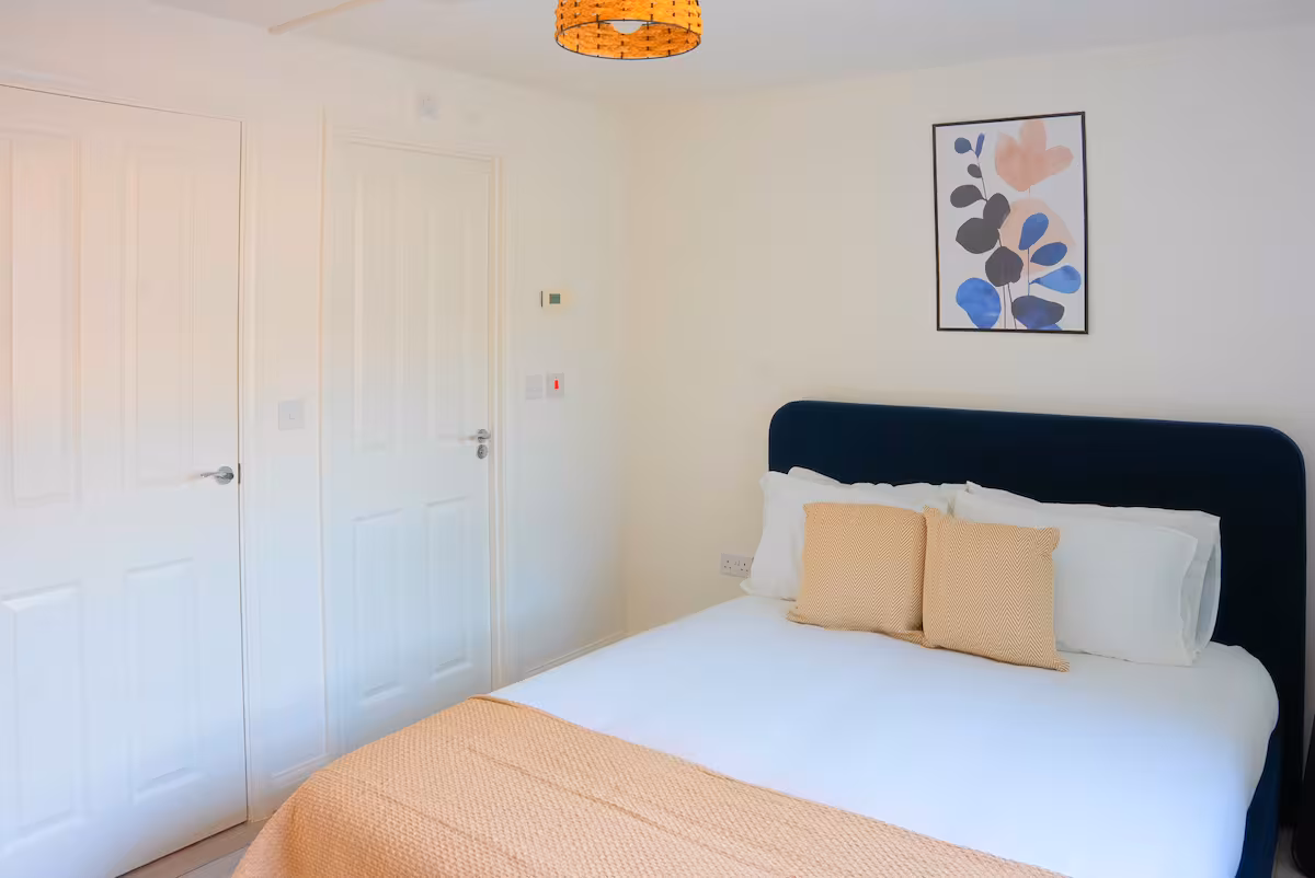 Propora Stays Birmingham — bedroom with botanical artwork